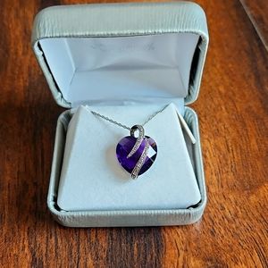Beautiful purple heart necklace with silver detailing. Comes in original box